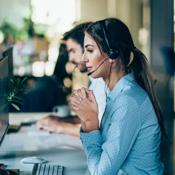 Woman On The Phone Helping A Customer
